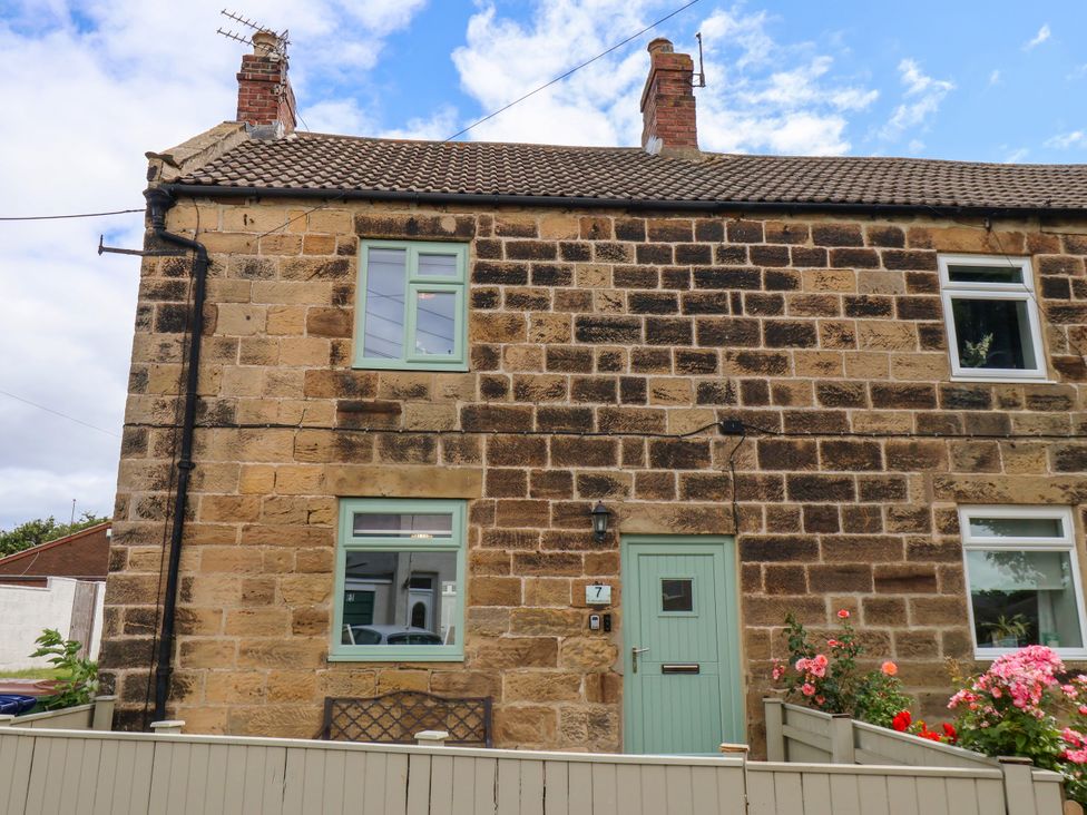 A house exterior with stone walls and windows at 7 St. Germains Lane