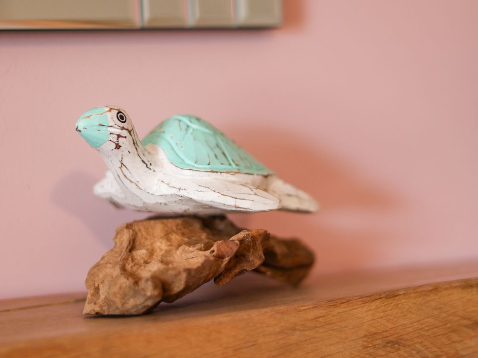 A turtle decoration on a wooden base at 7 St. Germains Lane