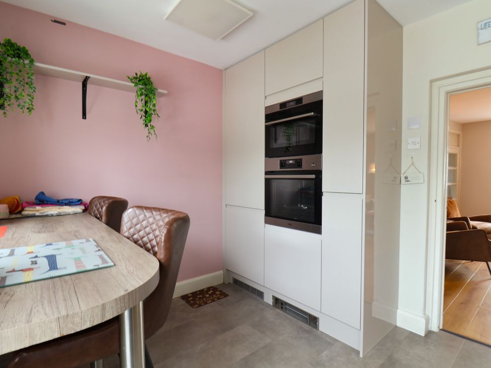 A kitchen with a table and chairs at 7 St. Germains Lane