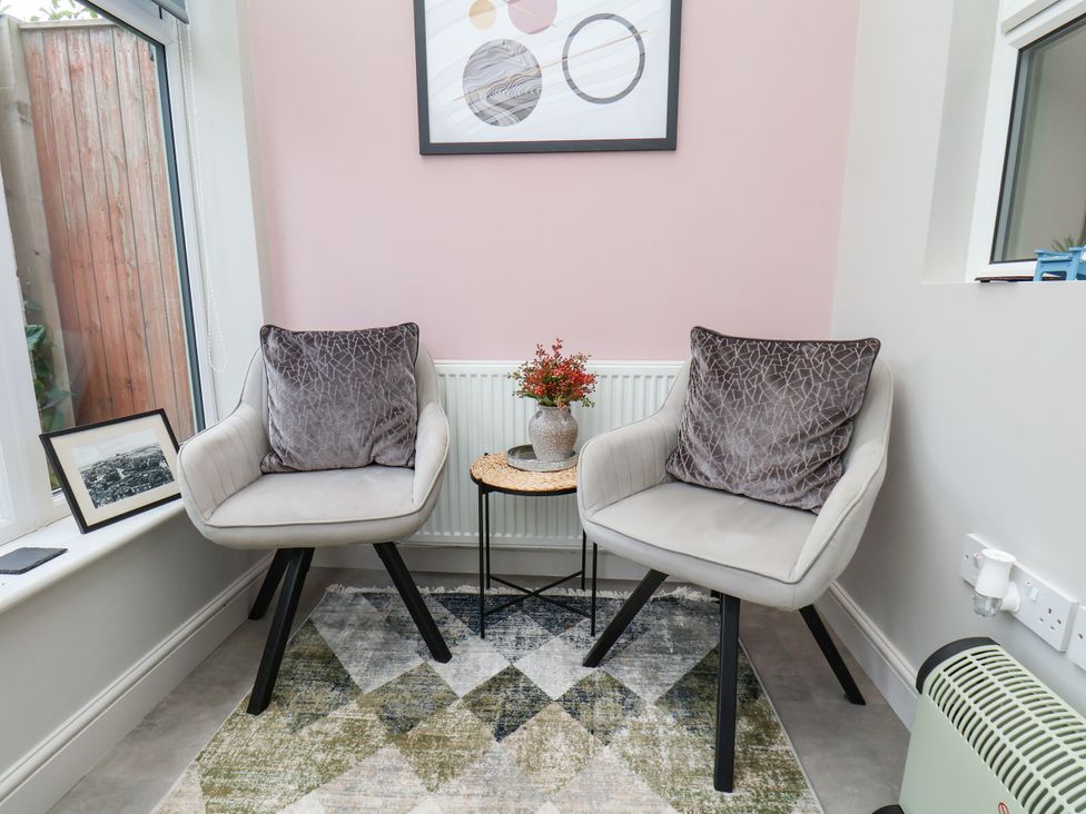 A snug with two chairs and a coffee table at 7 St. Germains Lane