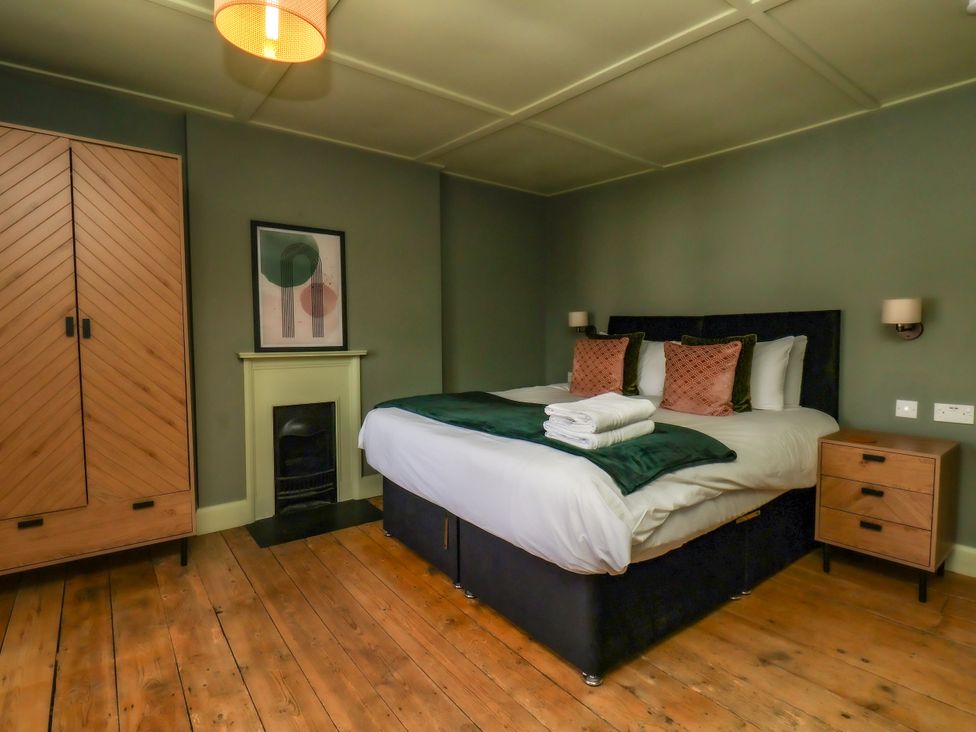 A bedroom with a bed and wardrobe at 7 St. Germains Lane