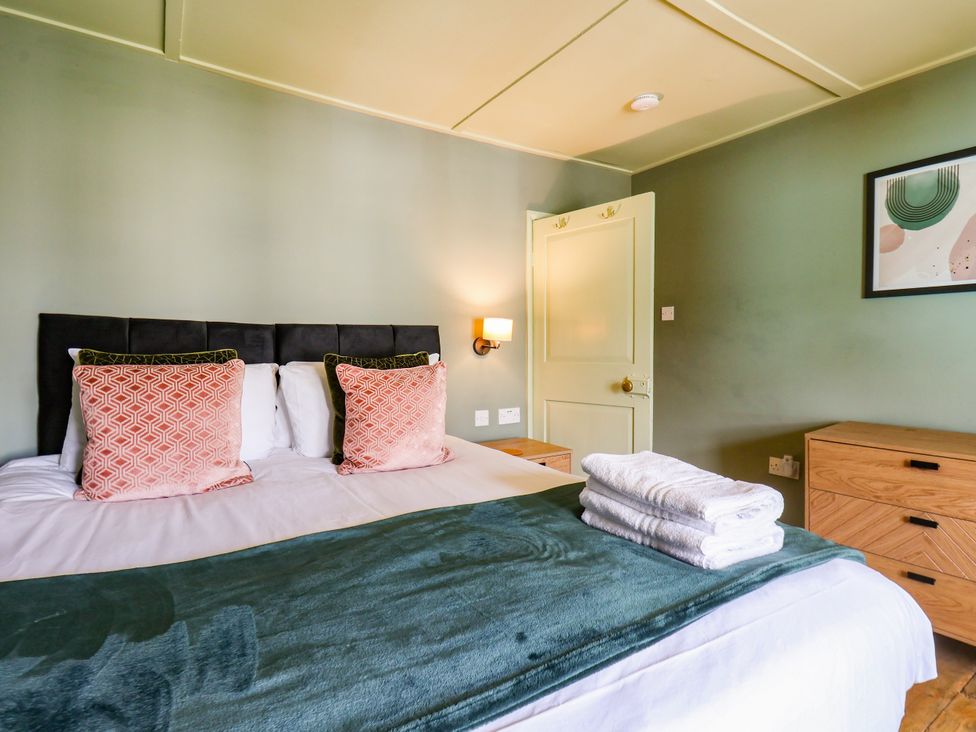 A bedroom with a bed and pillows at 7 St. Germains Lane 