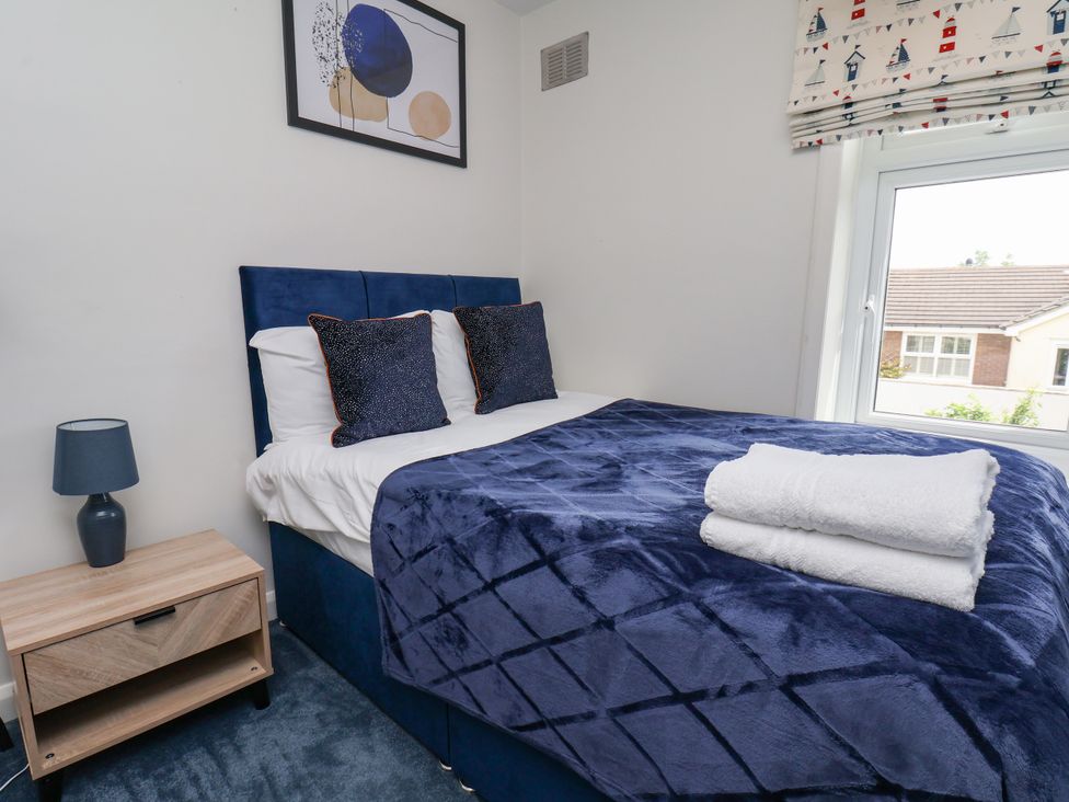 A bedroom with a bed and bedside table at 7 St. Germains Lane