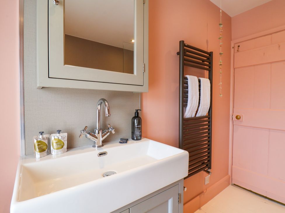 A bathroom with sink and towel radiator at 7 St. Germains Lane