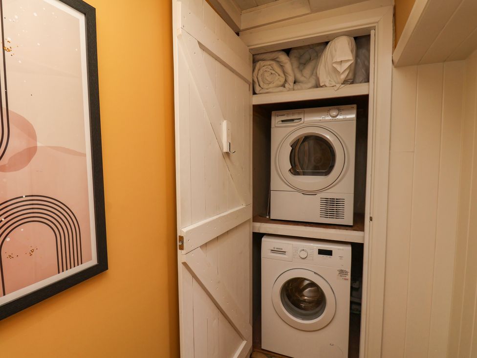 A laundry room with a washer and dryer in a closet at 7 St. Germains Lane