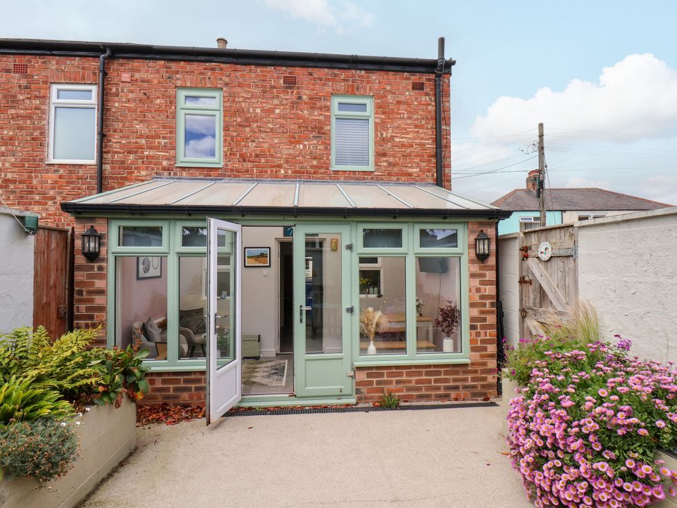 A conservatory with doors and windows at 7 St. Germains Lane