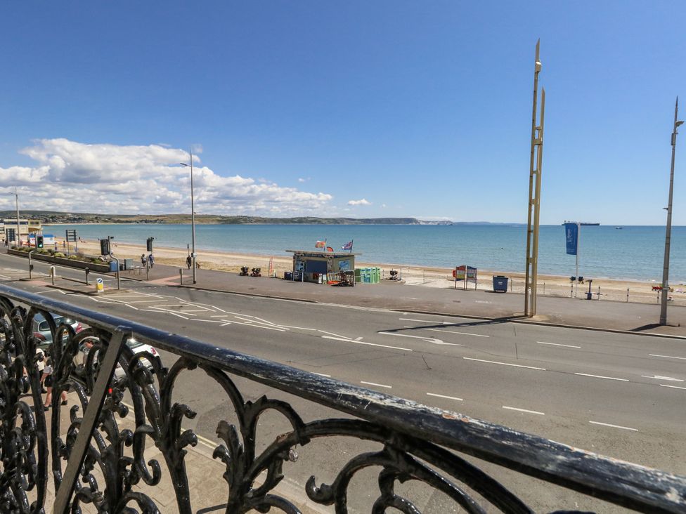 A beach view from a balcony at Apartment 1 in Weymouth