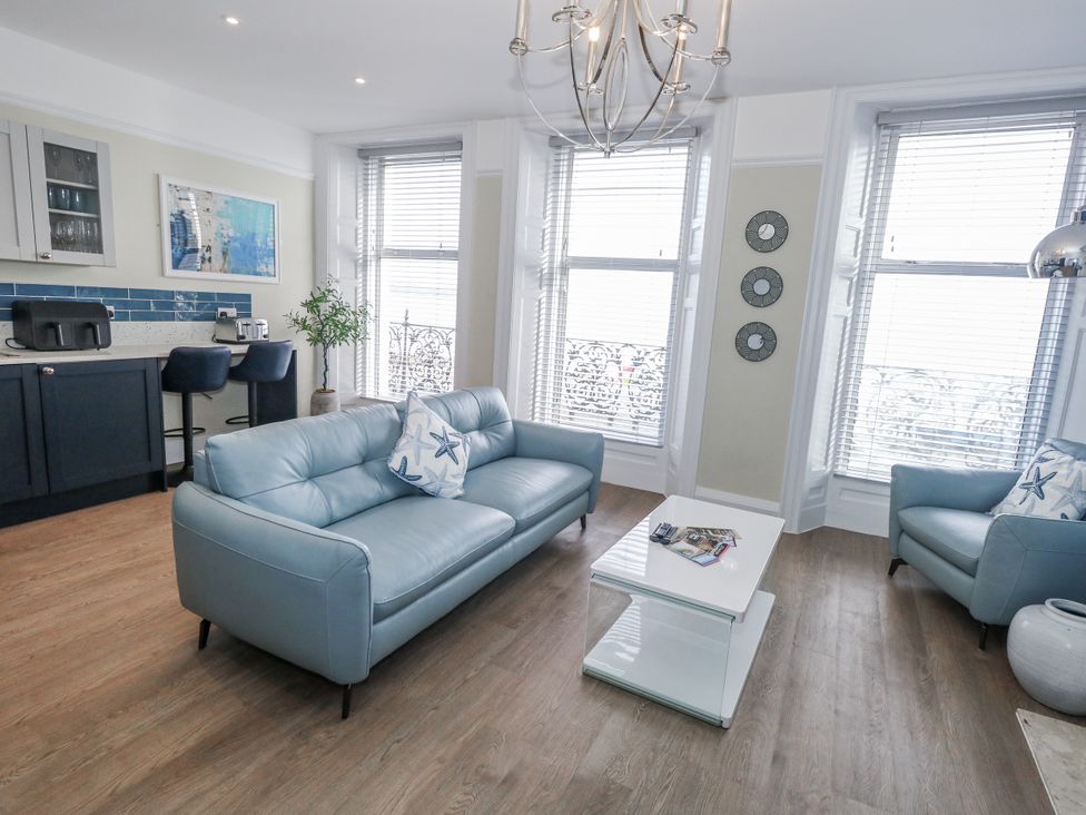 A living room with a sofa and coffee table at Vista Mare 1 in Weymouth