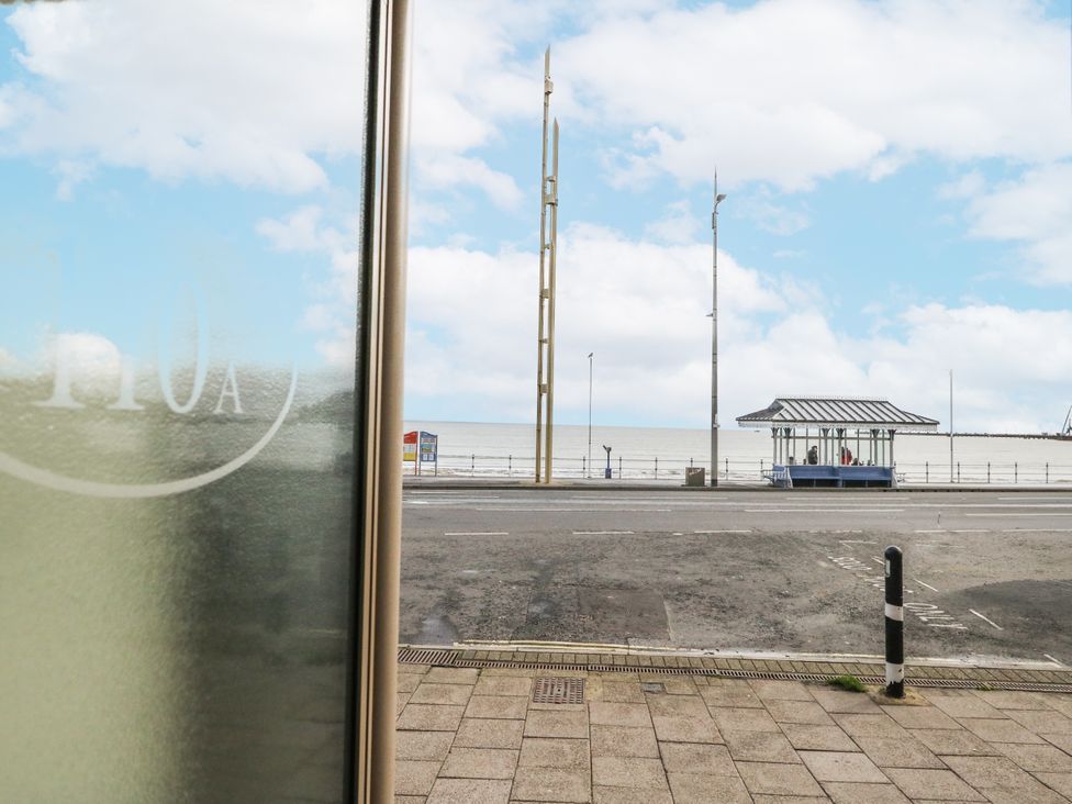 A view of the sea and bus stop at Vista Mare 2 in Weymouth