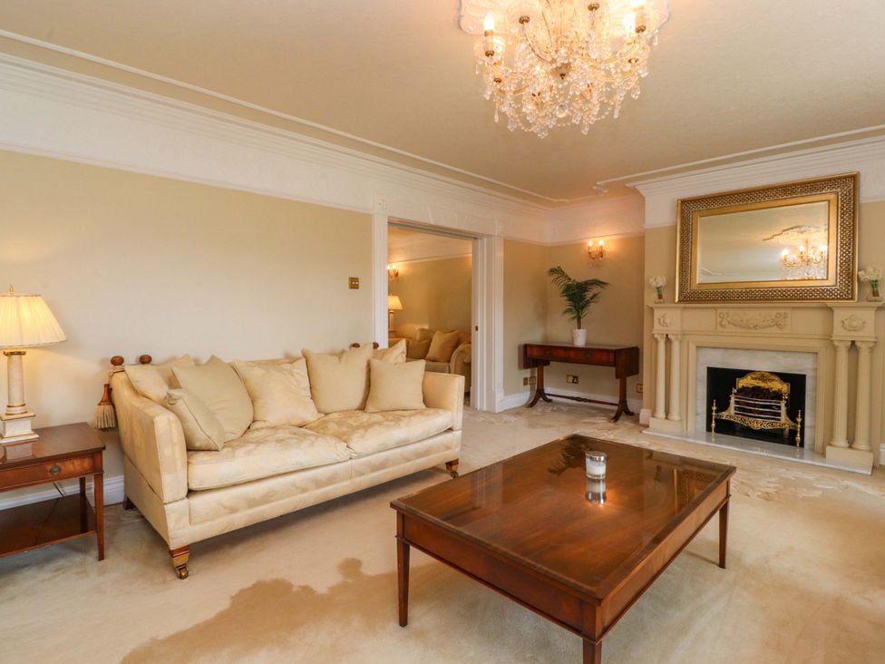 A living room with a sofa and coffee table at Laithe House in Burnley