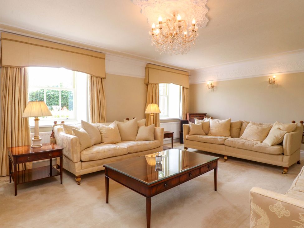 A living room with sofas and a coffee table at Laithe House in Burnley