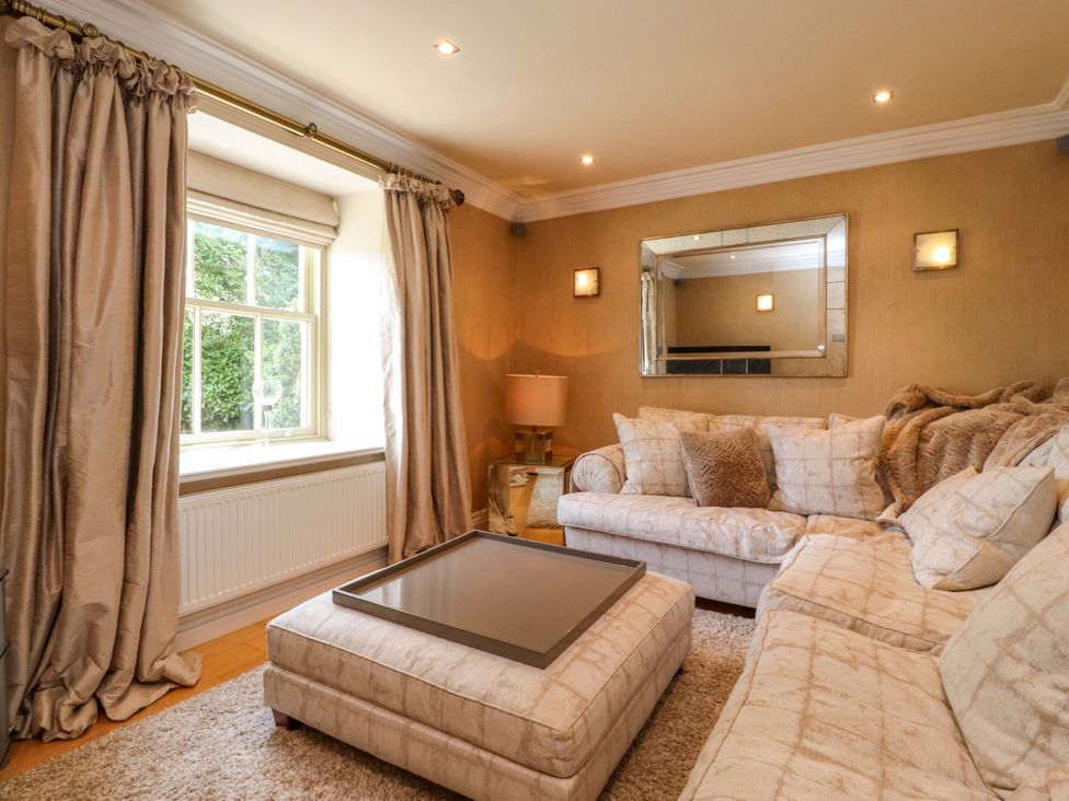 A living room with a couch and coffee table at Laithe House in Burnley