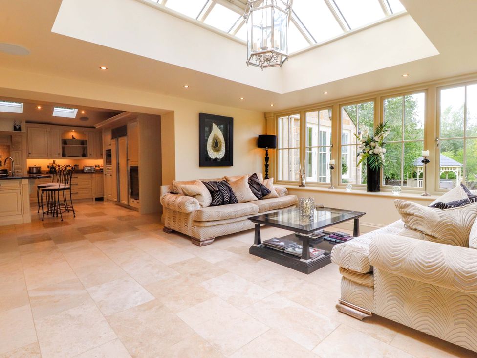 A living room with a coffee table and a sofa at Laithe House in Burnley