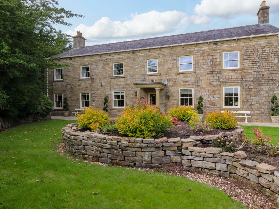 A house with windows and a garden at Laithe House in Burnley