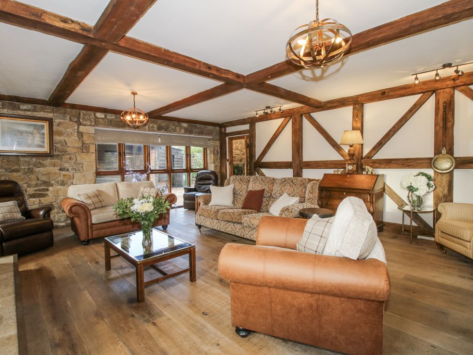 A living room with sofa and coffee table at Upper Home Farm near Cardington