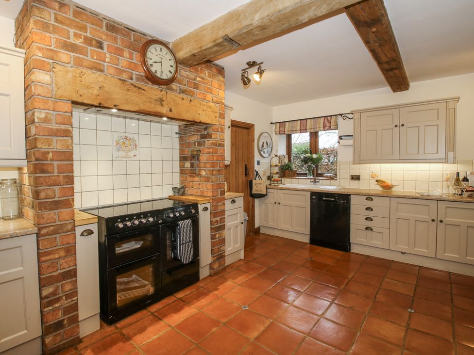 A kitchen with cabinetry and an oven at Upper Home Farm near Cardington