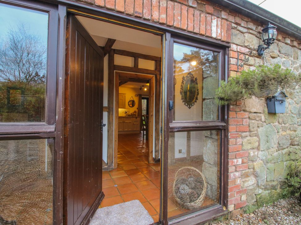 An entrance with a door and window at Upper Home Farm near Cardington