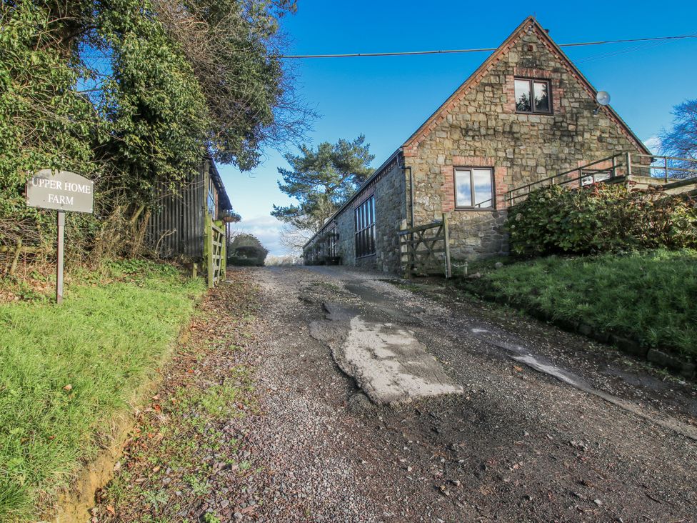A gravel road leading to a building at Upper Home Farm near Cardington