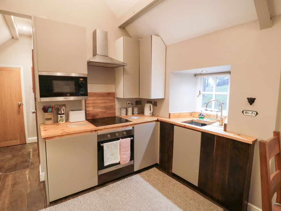 A kitchen with a stove and sink at Maltkiln House Annexe Chop Gate near Stokesley