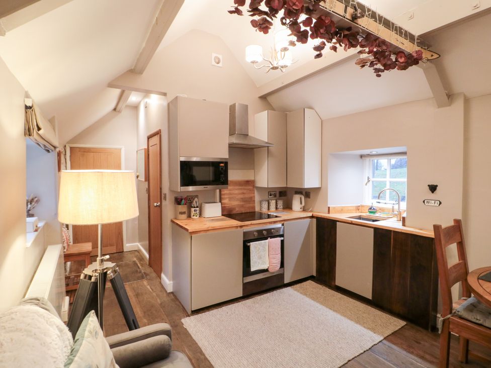 A kitchen with cabinets and appliances at Maltkiln House Annexe Chop Gate near Stokesley