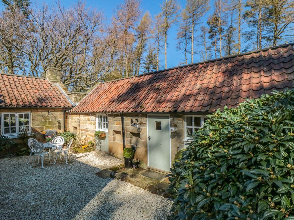A cottage with a table and chairs outside at Maltkiln House Annexe Chop Gate near Stokesley