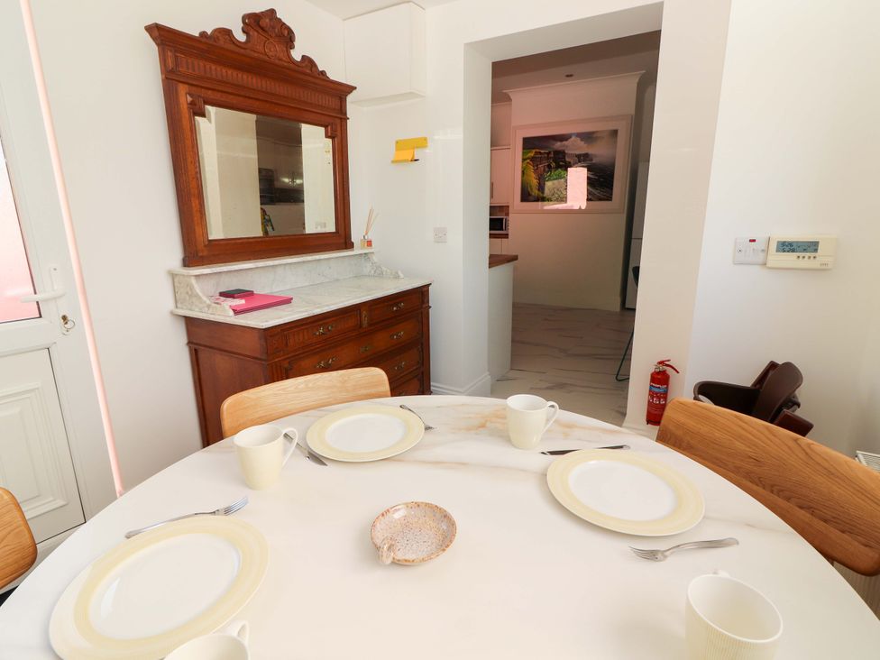A dining room with a table and chairs at Rosemont in Adare