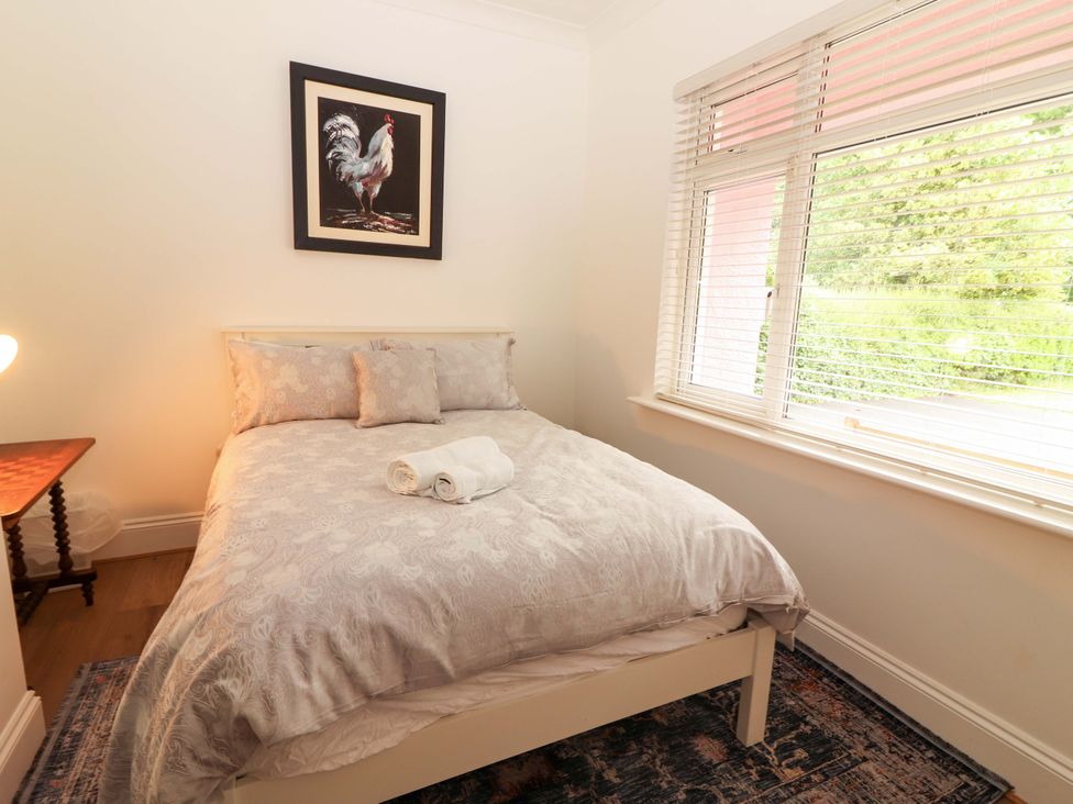 A bedroom with a bed and a painting at Rosemont in Adare