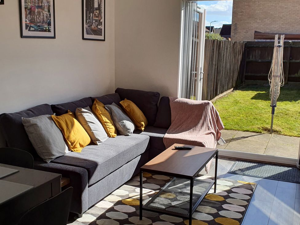 A living room with a sofa and coffee table at 32 Moorland House