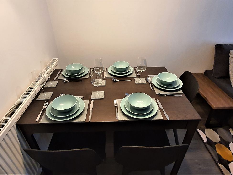 A dining table set for six at 32 Moorland House 