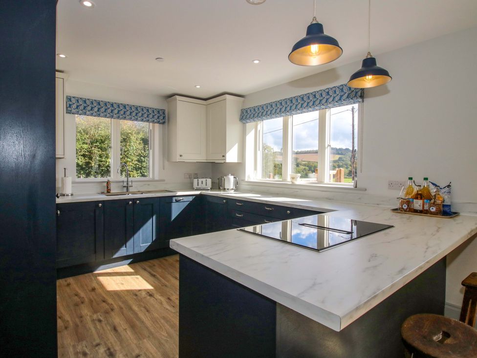 A kitchen with cabinets and a countertop at Hoddell Pitch Cottage in Kinnerton near New Radnor