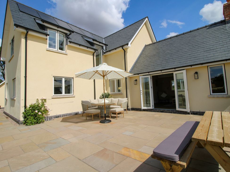 A patio with table and chairs at Hoddell Pitch Cottage Kinnerton near New Radnor
