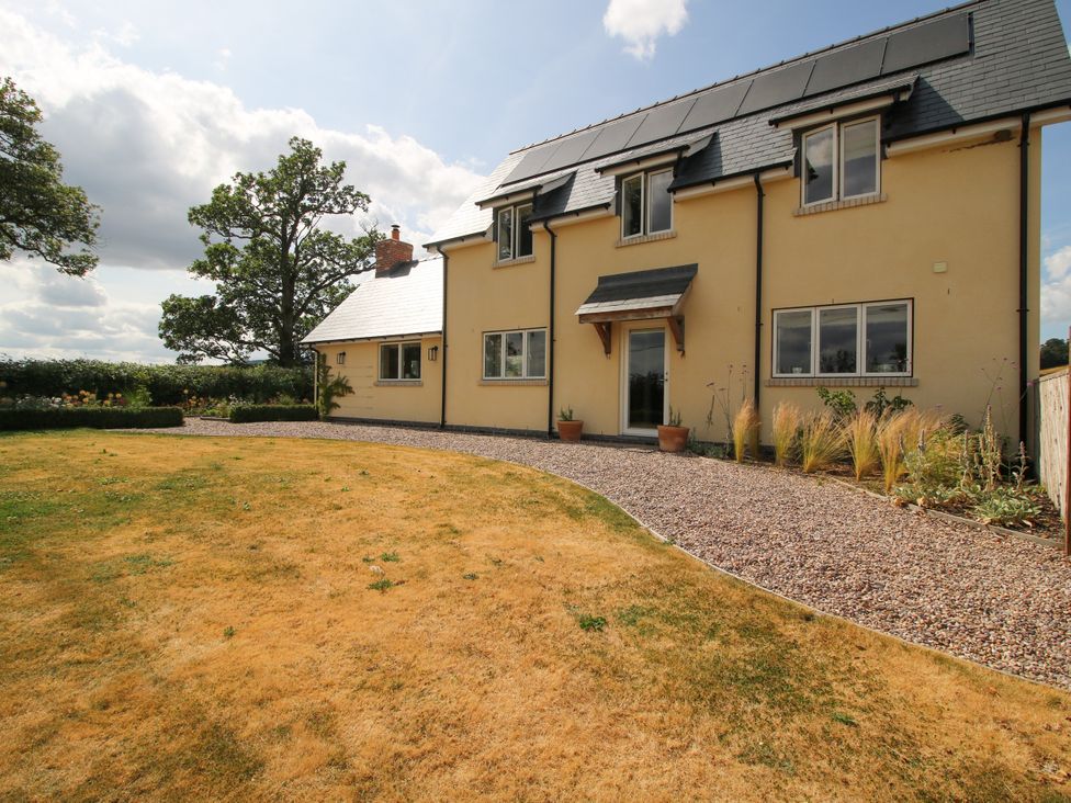 A house with solar panels and garden at Hoddell Pitch Cottage in Kinnerton near New Radnor