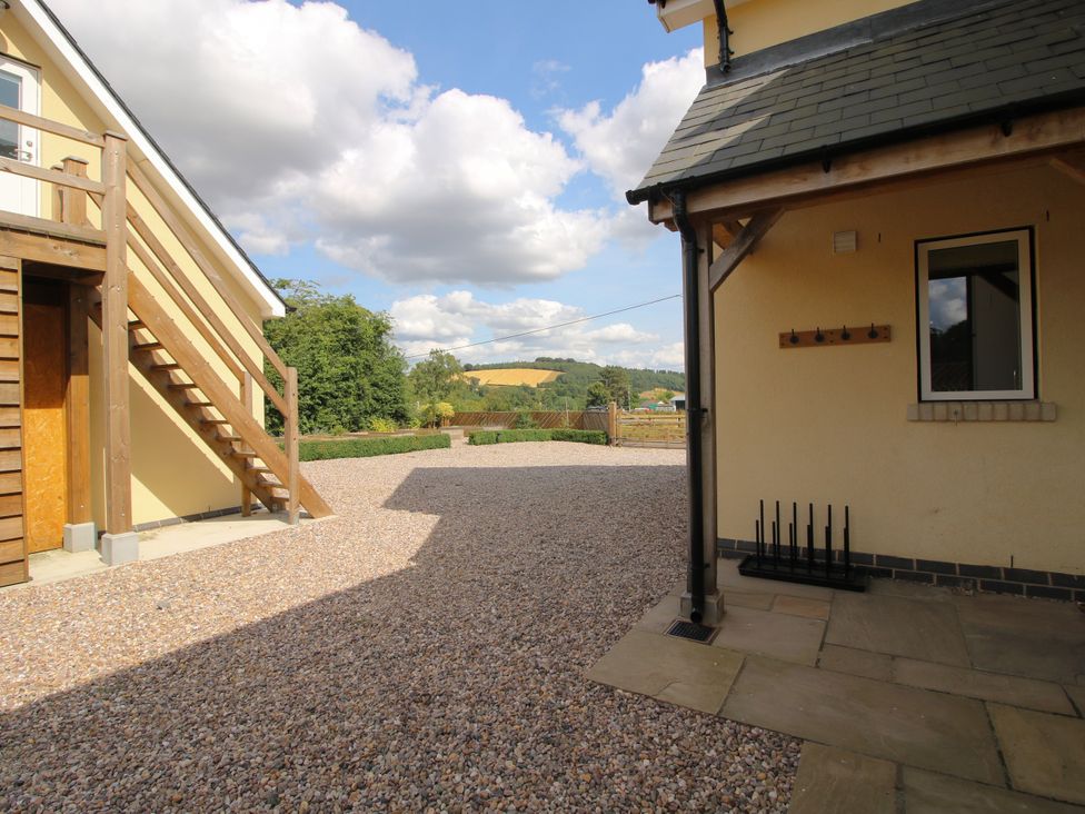 An outdoor area with a building and stairs at Hoddell Pitch Cottage Kinnerton near New Radnor