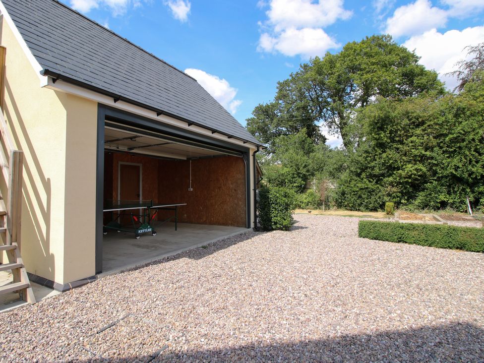 A garage with a table tennis table at Hoddell Pitch Cottage Kinnerton near New Radnor