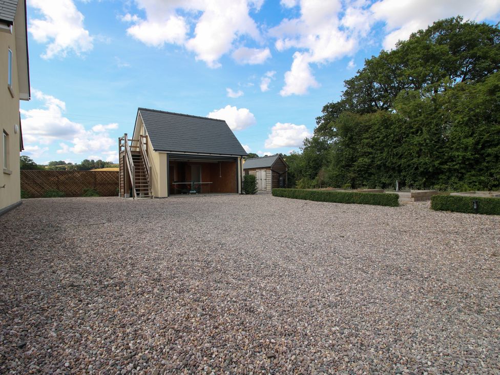 An outdoor space with a house and shed at Hoddell Pitch Cottage Kinnerton near New Radnor
