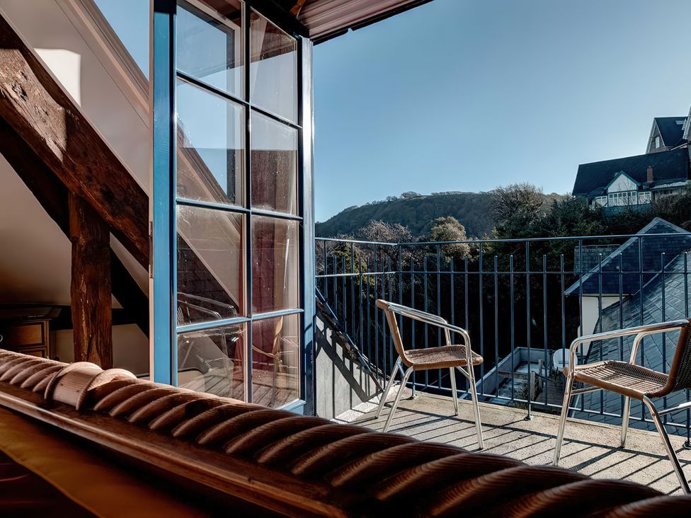 A balcony with chairs and a view at Bayview Tower in Lynton