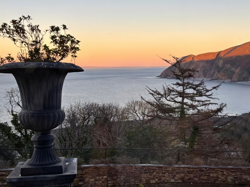 An outdoor area with a planter overlooking the ocean at Bayview Tower in Lynton