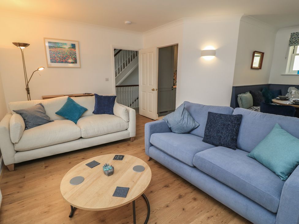 A living room with sofas and a coffee table at Weyside in Weymouth