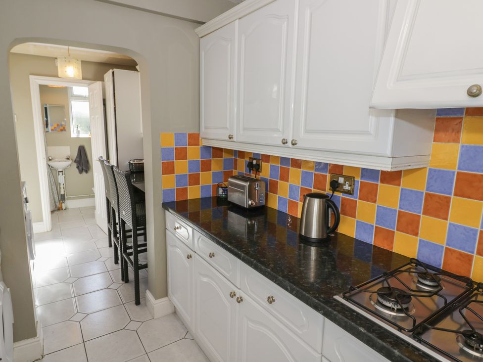 A kitchen with a kettle and toaster at Cosy Escape Birmingham
