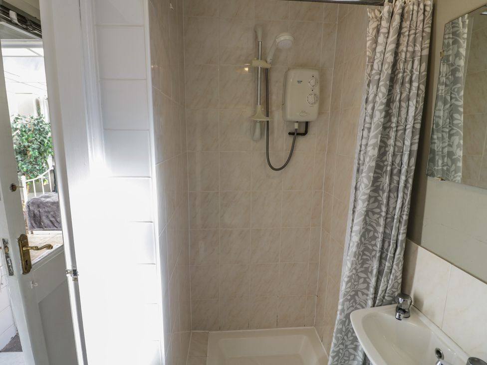 A bathroom with a shower and sink at Cosy Escape in Birmingham
