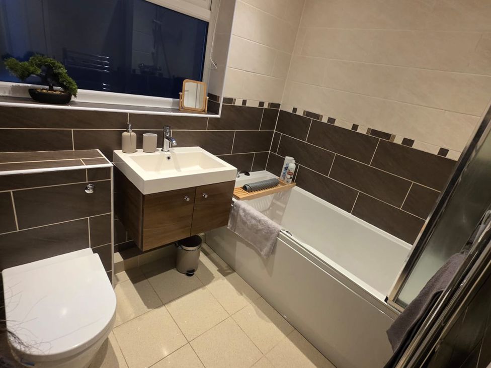 A bathroom with a sink and toilet at 12 Gorse Lane Leicester