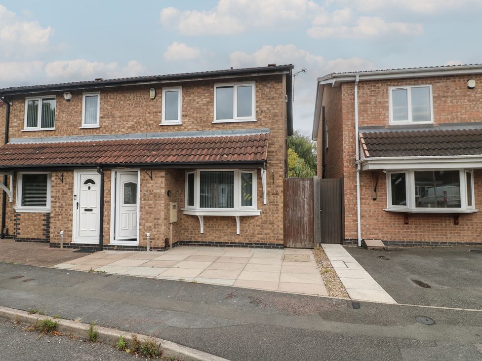 A house with a front door and windows at 12 Gorse Lane Syston