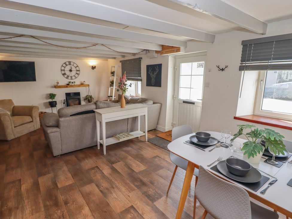 A living room with seating and dining area at 41 St. James Street Narberth
