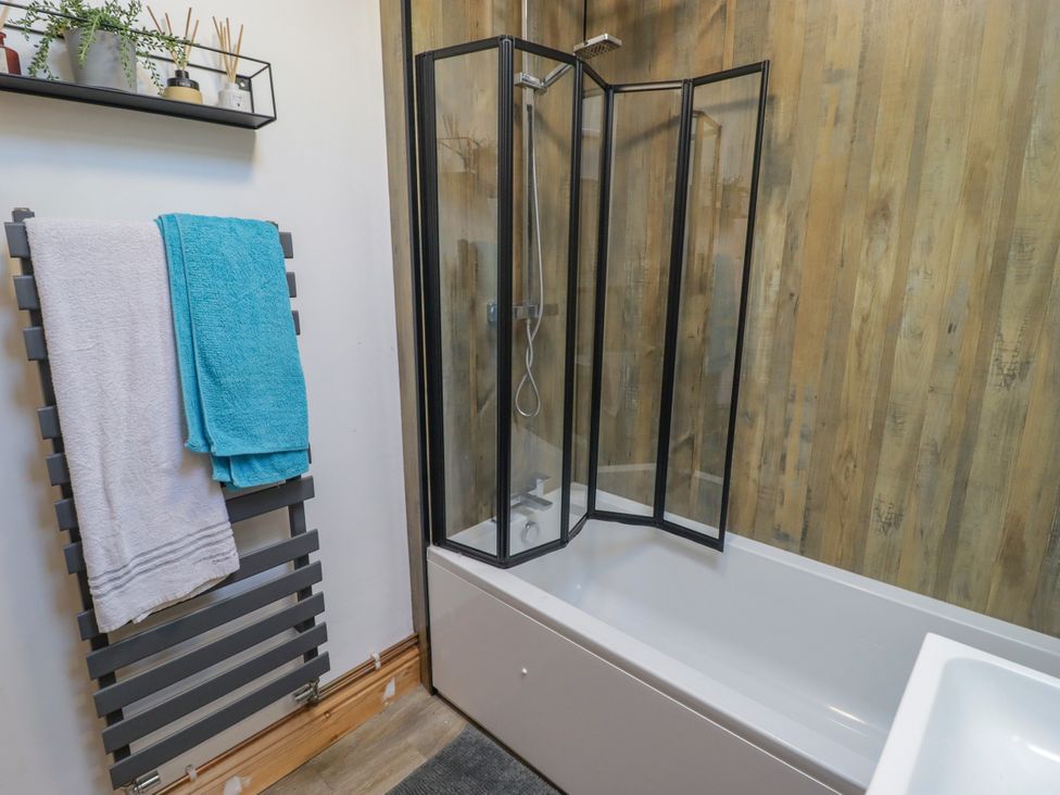 A bathroom with a shower and bathtub at 41 St. James Street Narberth