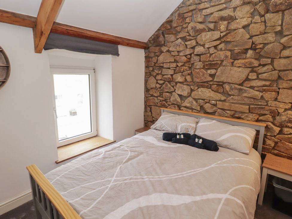 A bedroom with a bed and window at 41 St. James Street Narberth