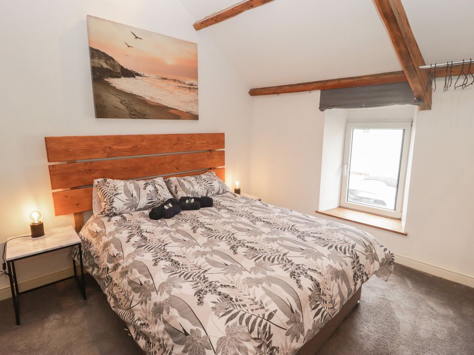 A bedroom with a bed and a window at 41 St. James Street Narberth