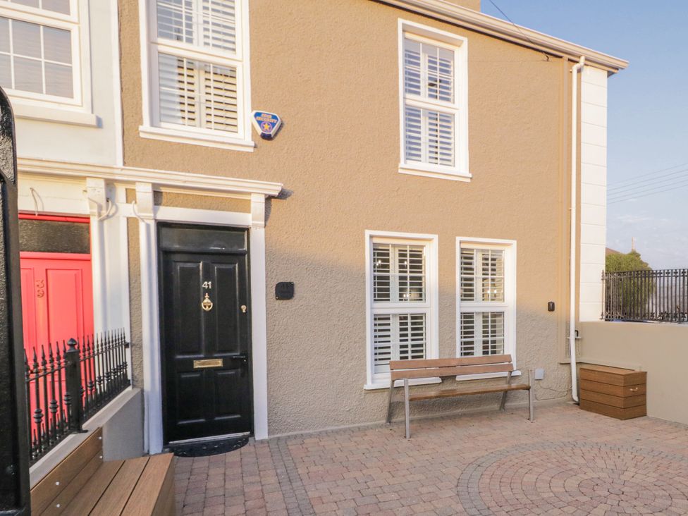 An entrance with a bench and door at 41 Church view in Portstewart