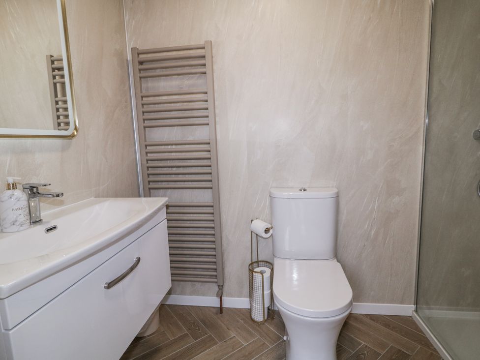 A bathroom with a sink, toilet, and shower at 41 Church view Portstewart