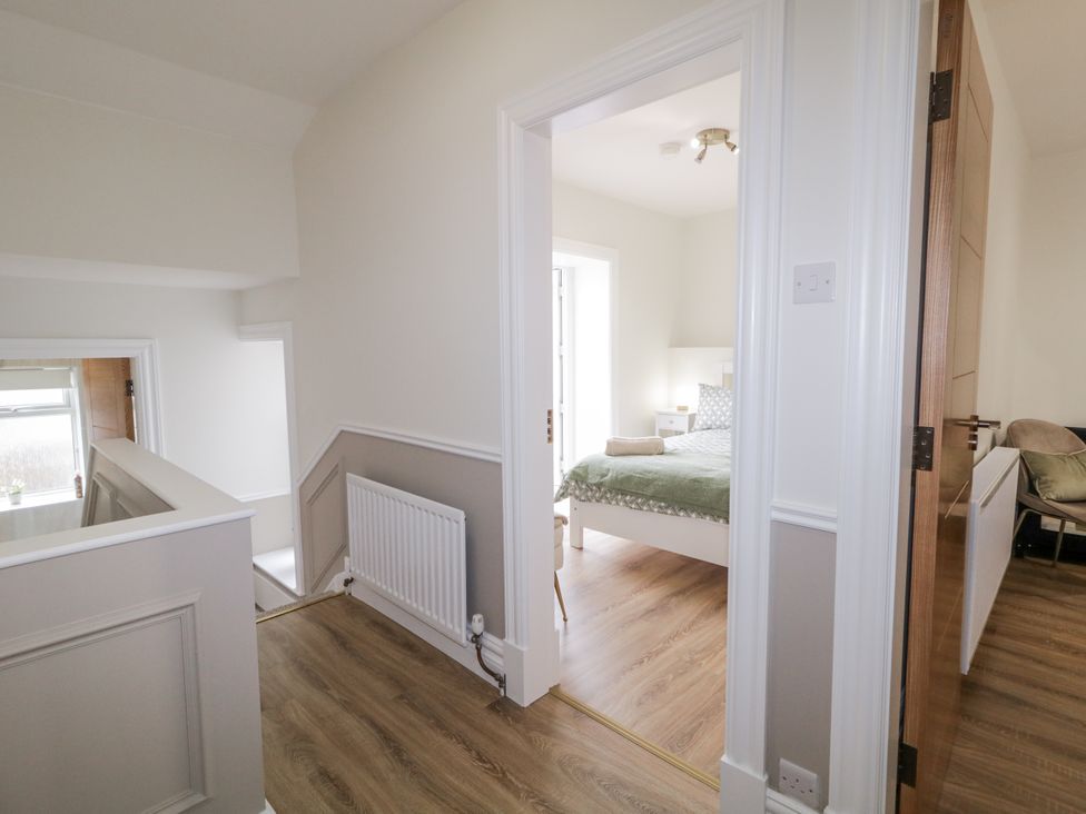 A hallway leading to a bedroom at 41 Church view in Portstewart