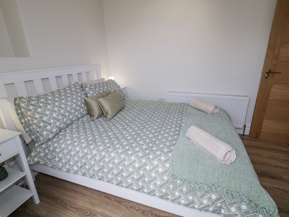 A bedroom with a bed and bedside table at 41 Church view in Portstewart